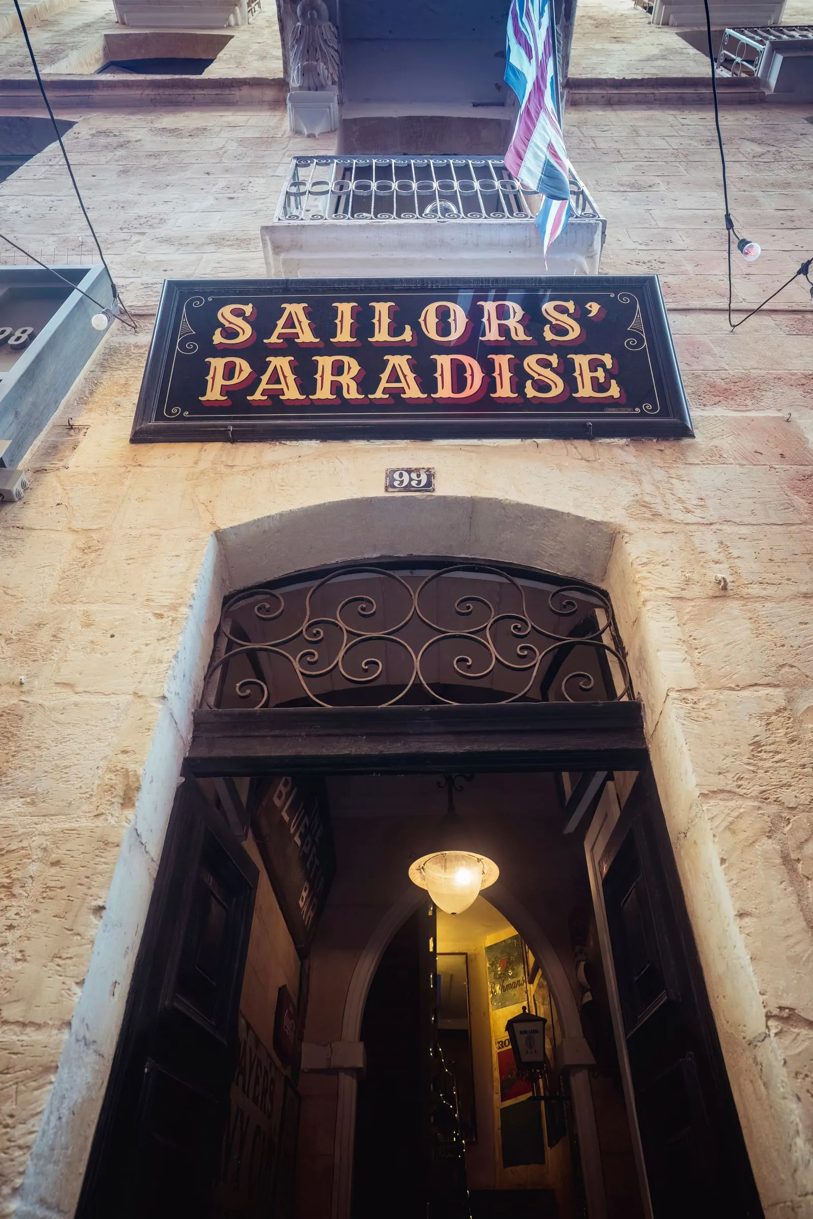 The Sailors' Paradise sign above the arched doorway at 99 Strait Street, Valletta.