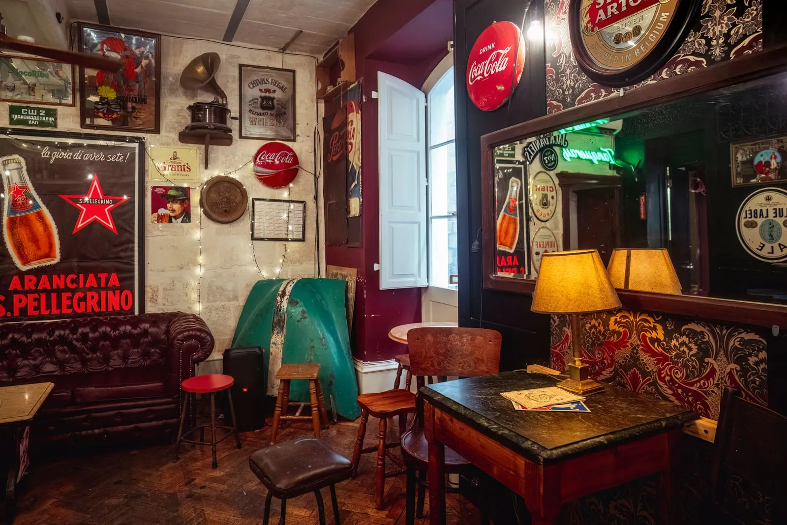 Leather Chesterfield sofas and a lamp-lit corner of the bar, its walls hung with wartime memorabilia.