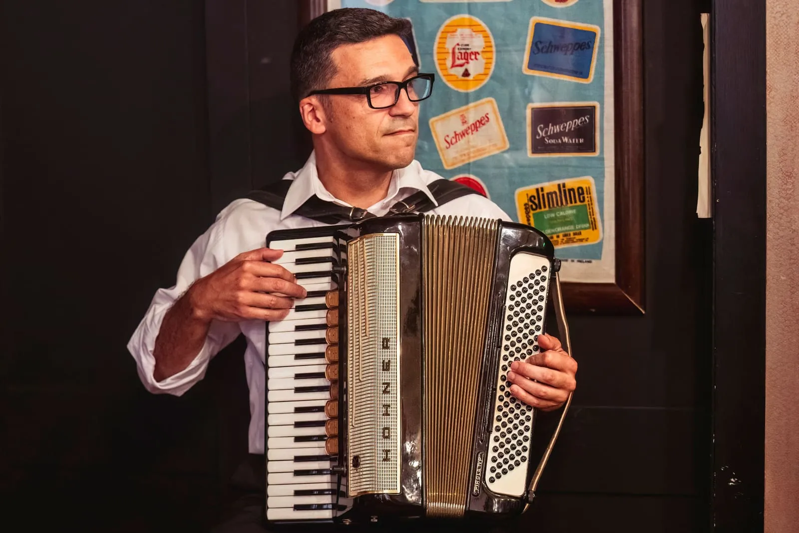 Gennaro, the bar's accordionist, playing during the performance.